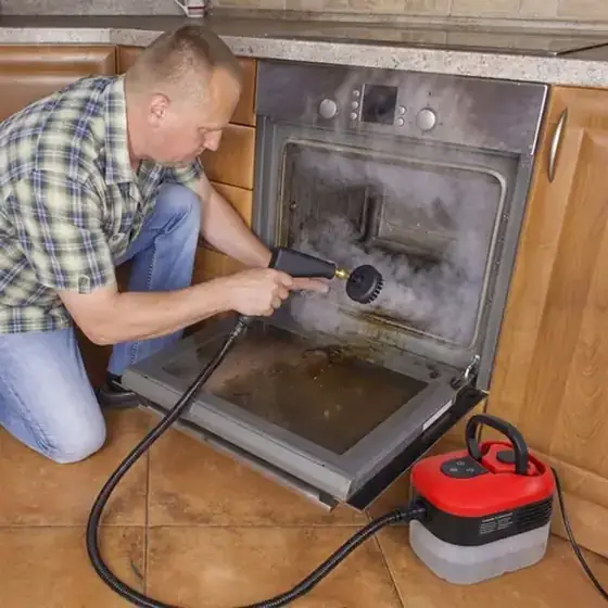 Official Power Blast Plus image showing a handheld steam nozzle at an oven