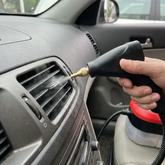 Official image demonstrating the Power Blast Plus nozzle at a car interior vent