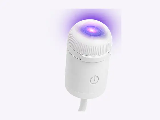 Official close-up of the StarNest projector lens, ribbed ring, and front control